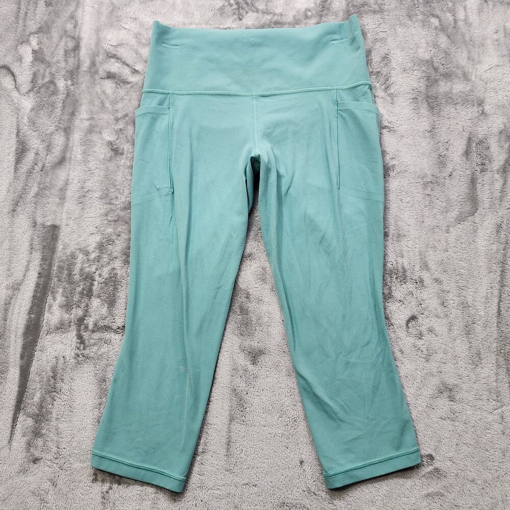 Athleta Leggings Womens M Blue Green Salutation Stash Capri Pockets Workout Yoga
